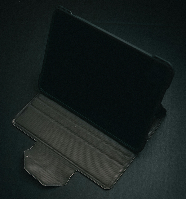 Tablet device with case with a black background behind